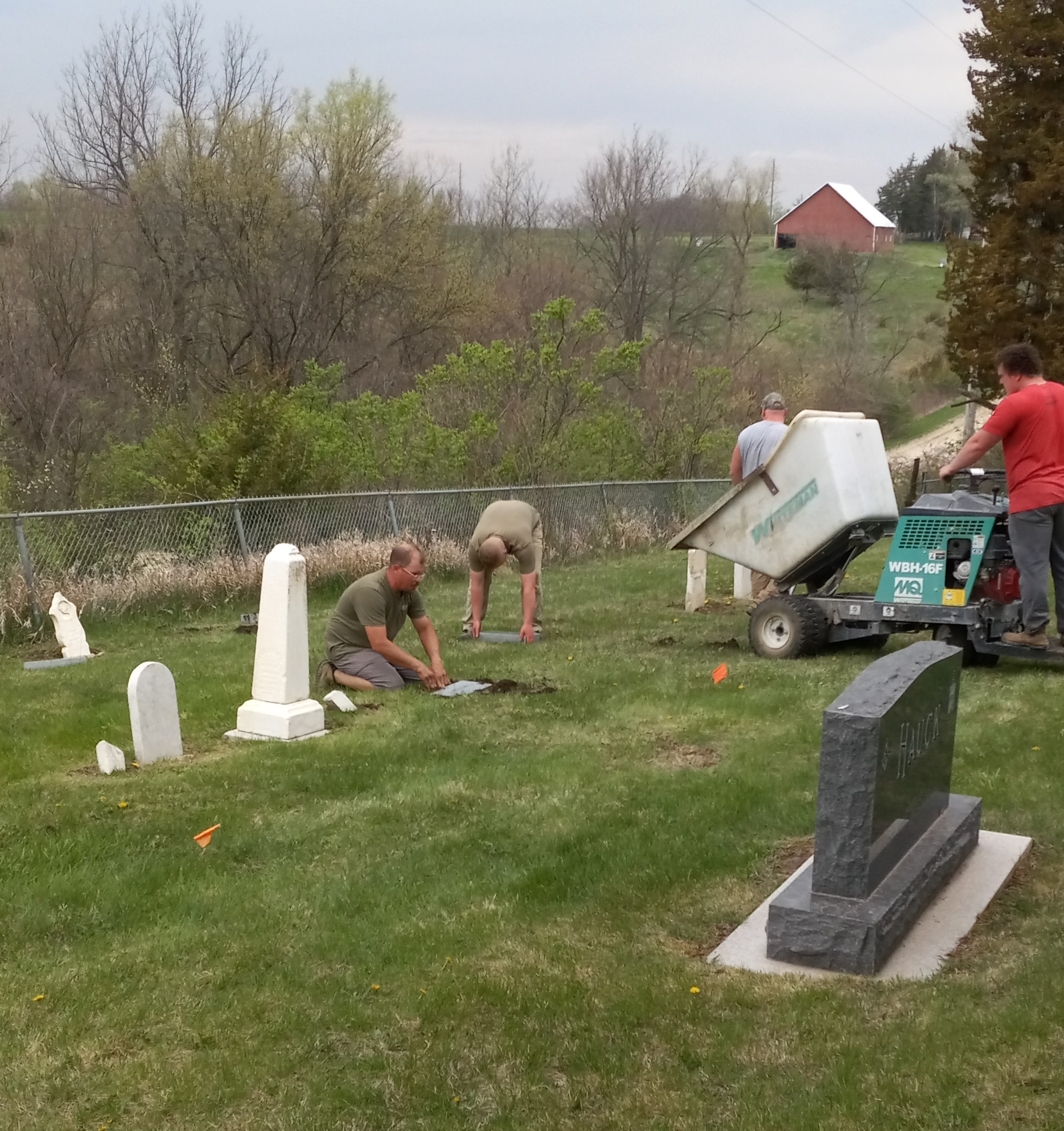 Pouring concrete and setting stones at Mt. Tabor Cemetery.