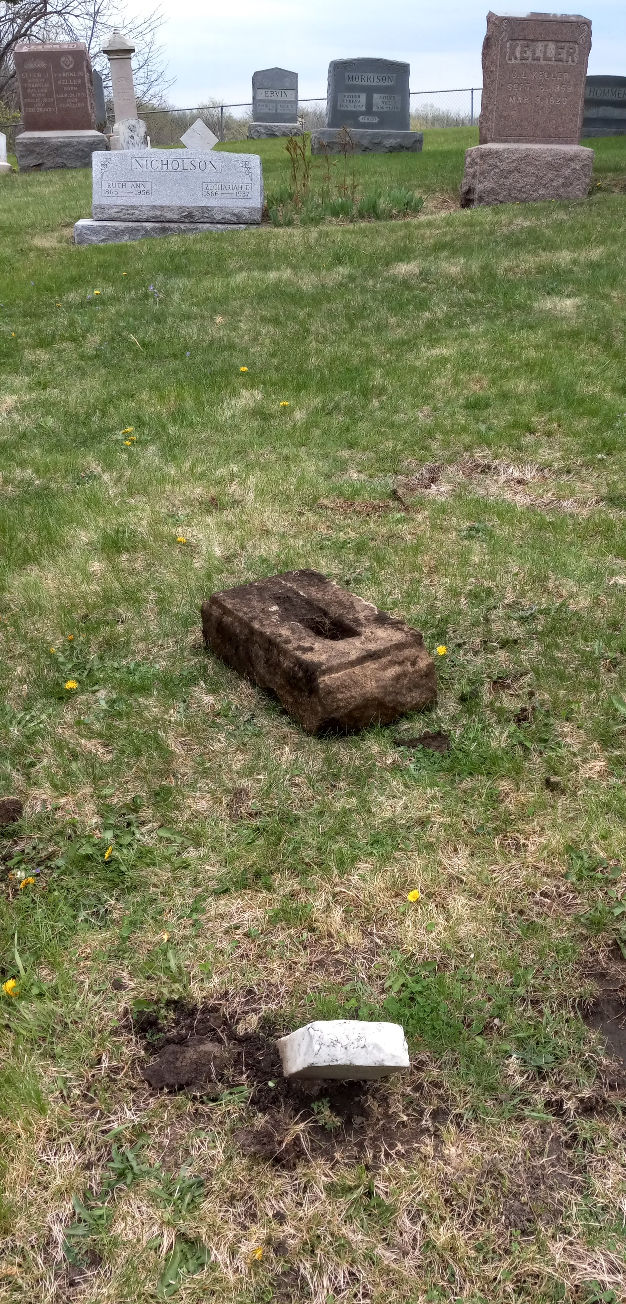 The headstone base removed.